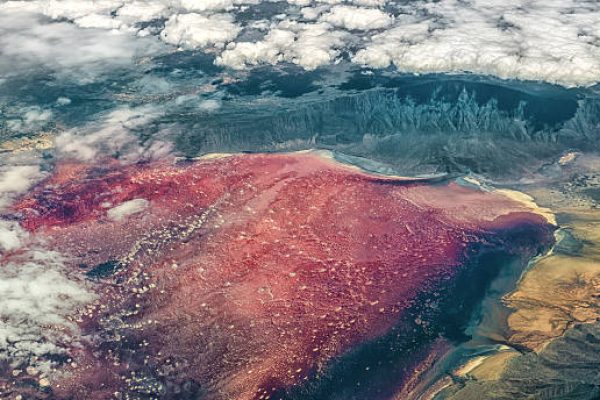 Aerial view of Lake Natron, found near Mount Kilimanjaro in Tanzania, with bright red color attributed to salt loving halophile organisms